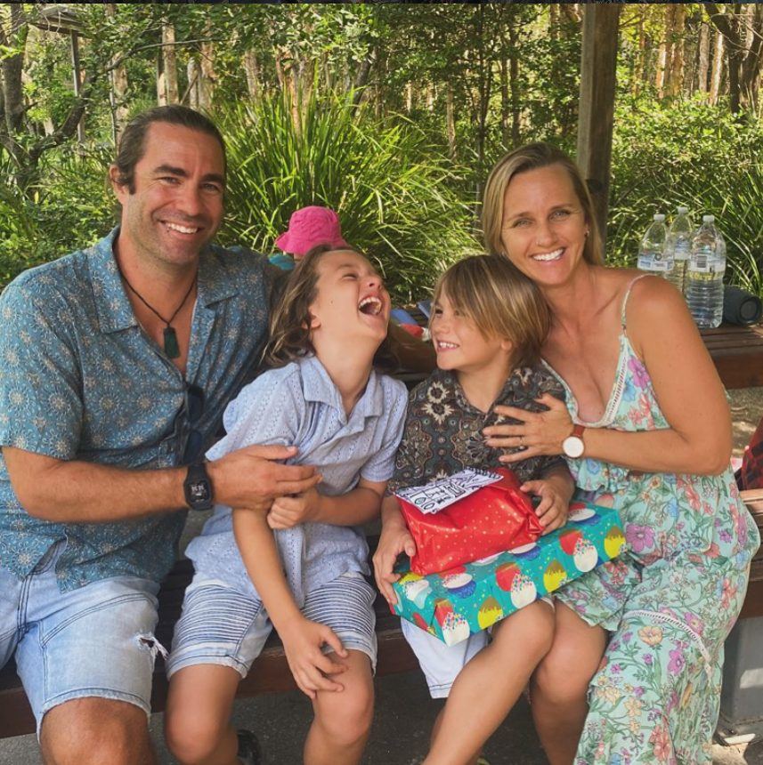 Adam Monaghan and his family together outdoors, laughing